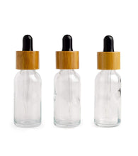 Load image into Gallery viewer, Single white 30ml glass bamboo dropper bottles 1 oz boston round white or black bulbs