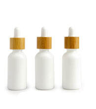 Load image into Gallery viewer, Single white 30ml glass bamboo dropper bottles 1 oz boston round white or black bulbs